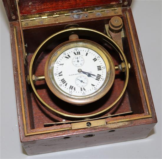 An Elgin National Watch Co teak cased brass deck watch, W.5.25in. H.5.5in.